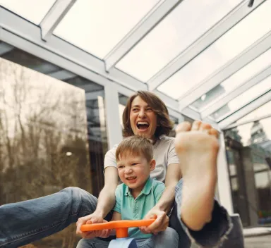 Mother and child on a childrens scooter