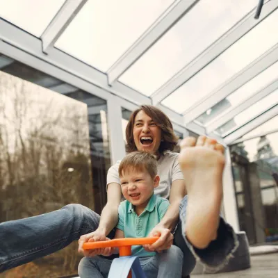 Mother and child on a childrens scooter