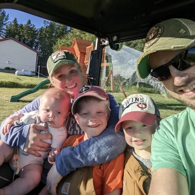 Family outside taking selfie