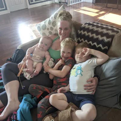 Mom with her three children on the couch