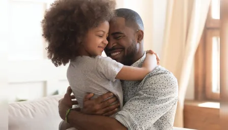 Daughter hugging her dad