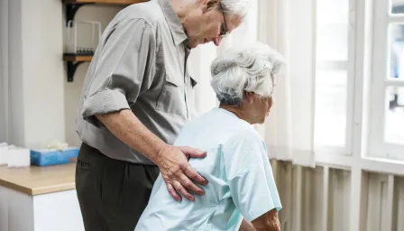 Elderly couple looking out a window
