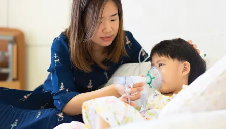 Mom helping her son breathe