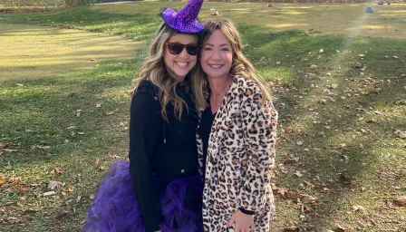 Two women dressed up for Halloween on a golf course