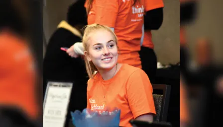 Woman smiling at event registration